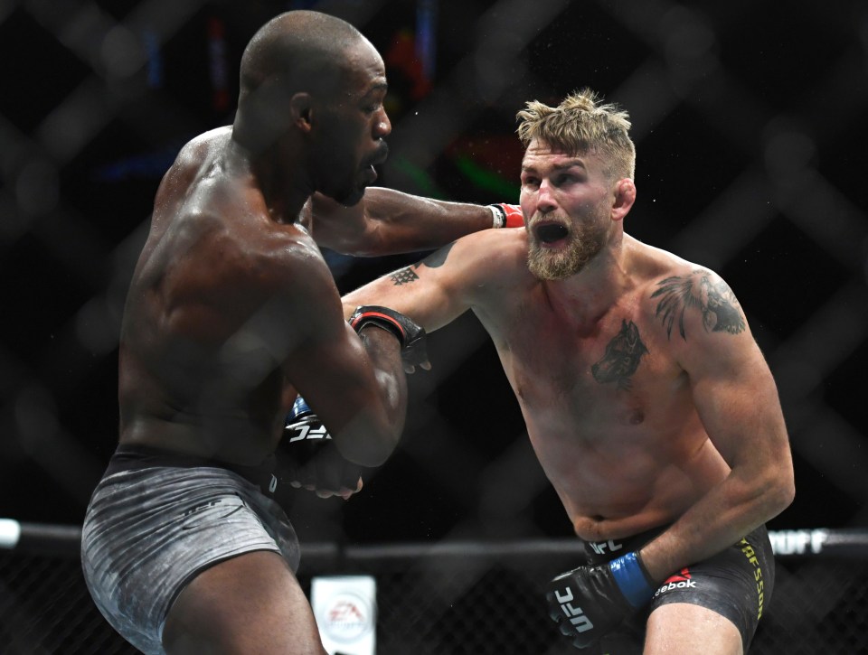 Alexander Gustafsson, right, lands a punch to Jon Jones during the UFC men's light heavyweight title mixed martial arts bout at UFC 232, Saturday, Dec. 29, 2018, in Inglewood, Calif. (AP Photo/Kyusung Gong)