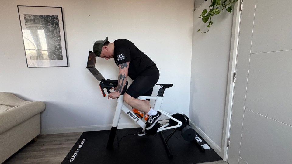 Man using a Zwift indoor cycling trainer.