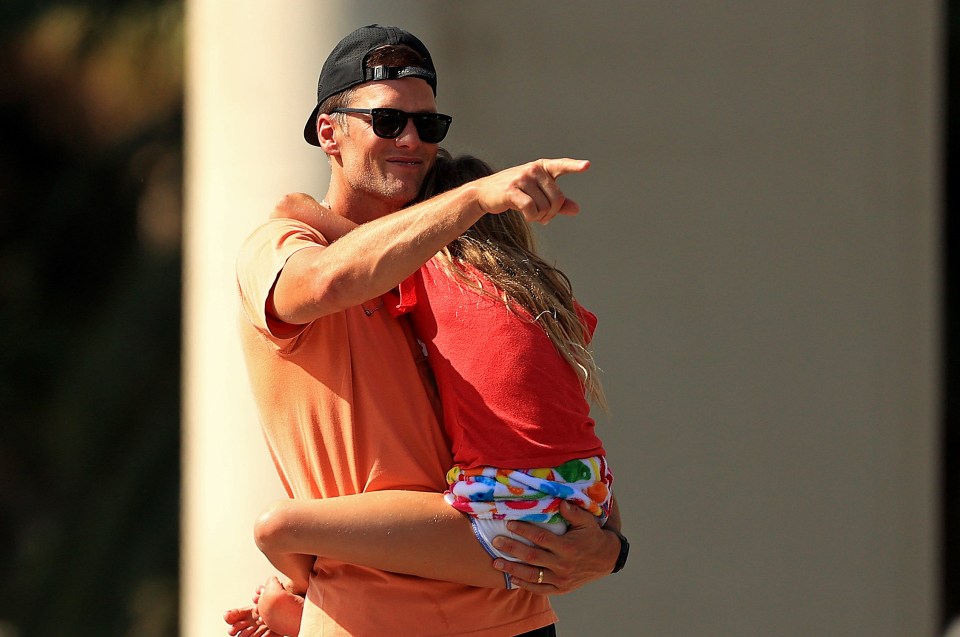 Brady's daughter was heard telling him not to throw the trophy off the boat