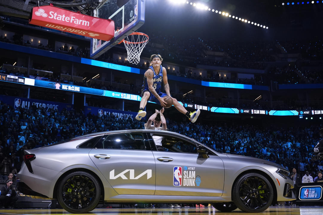 Osceola Magic guard Mac McClung dunks over a car during the slam dunk contest at the NBA basketball All-Star Saturday night festivities Saturday, Feb. 15, 2025, in San Francisco. (AP Photo/Godofredo A. Vásquez)