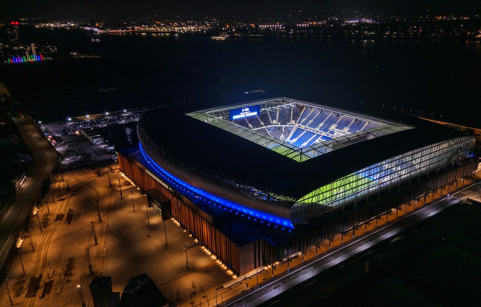 Aerial view of Everton Stadium at night.