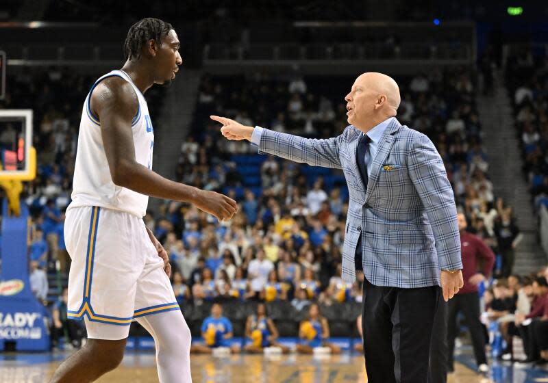 LOS ANGELES, CA - FEBRUARY 18: UCLA Bruins head coach Mick Cronin has words for UCLA Bruins guard Eric Dailey Jr. (3) during the game between the Minnesota Gophers and the UCLA Bruins on February 18, 2025, at Pauley Pavilion in Los Angeles, CA. (Photo by David Dennis/Icon Sportswire via Getty Images)