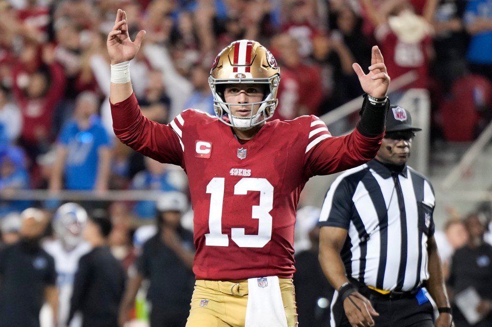 Brock Purdy #13 of the San Francisco 49ers celebrates a touchdown.