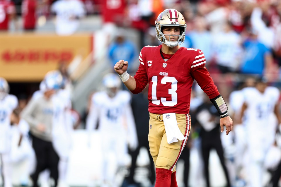 Brock Purdy #13 of the San Francisco 49ers celebrates after a touchdown.