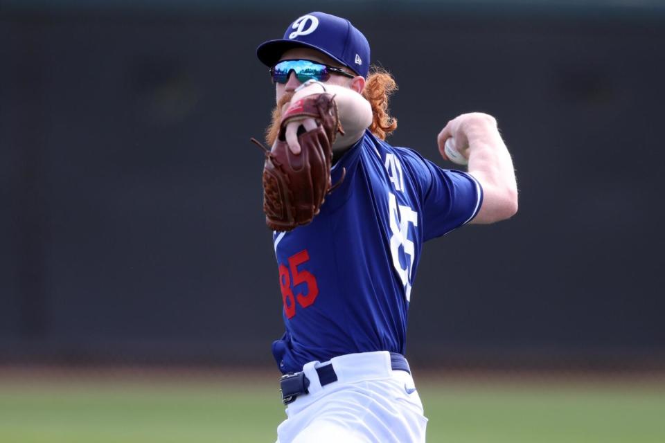 Dodgers pitcher Dustin May throws during a workout at Camelback Ranch.