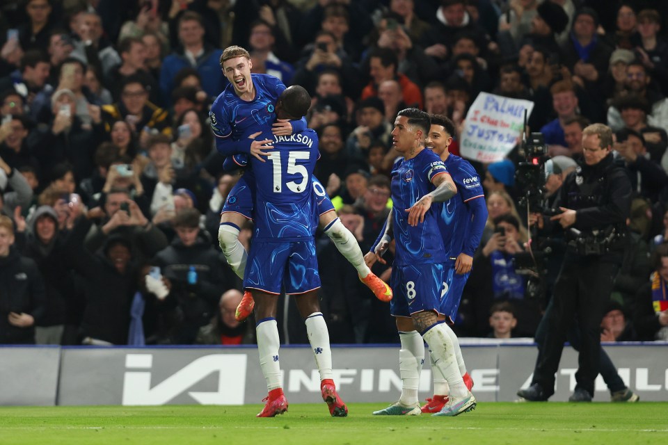 Chelsea's Cole Palmer celebrates scoring a goal with teammates.