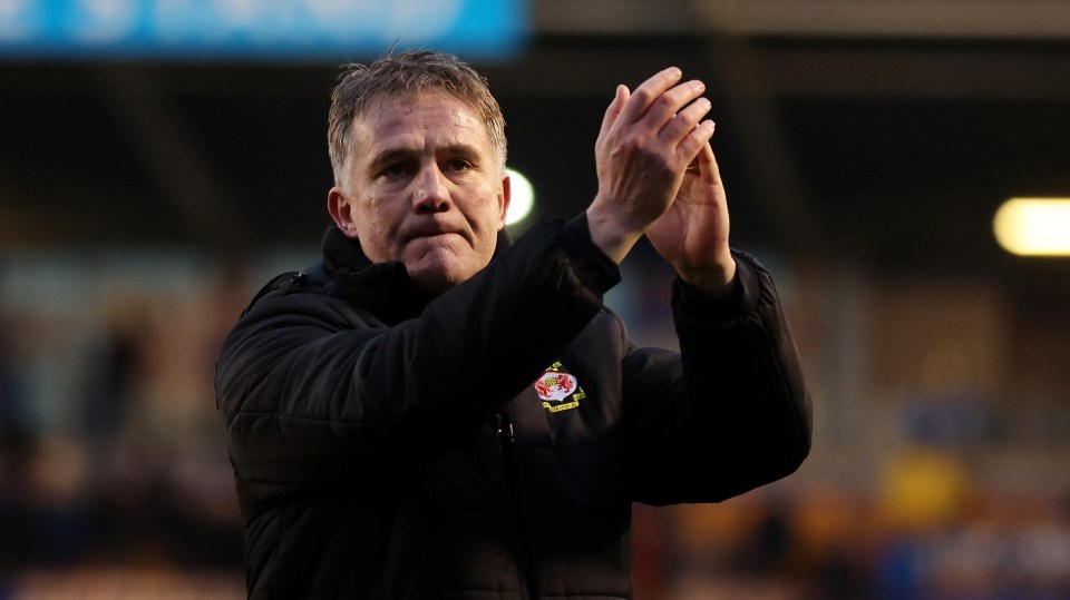 Phil Parkinson, Wrexham manager, applauding.