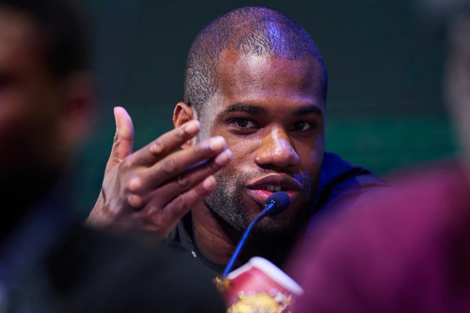 Close-up of Dubois speaking into a microphone.