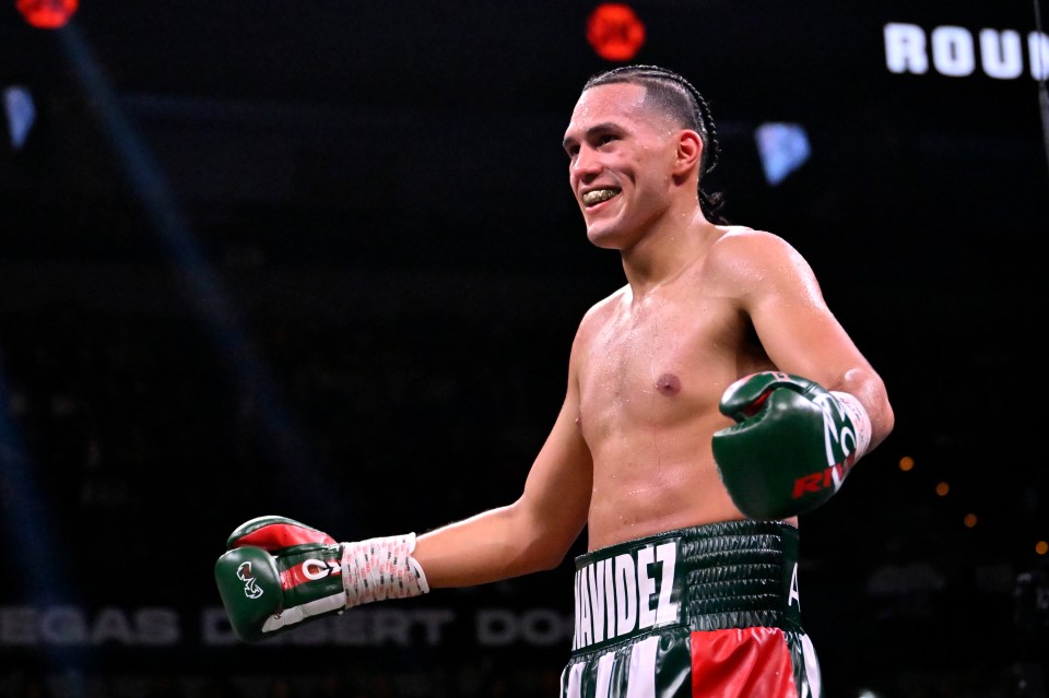 David Benavidez victorious in a boxing match.