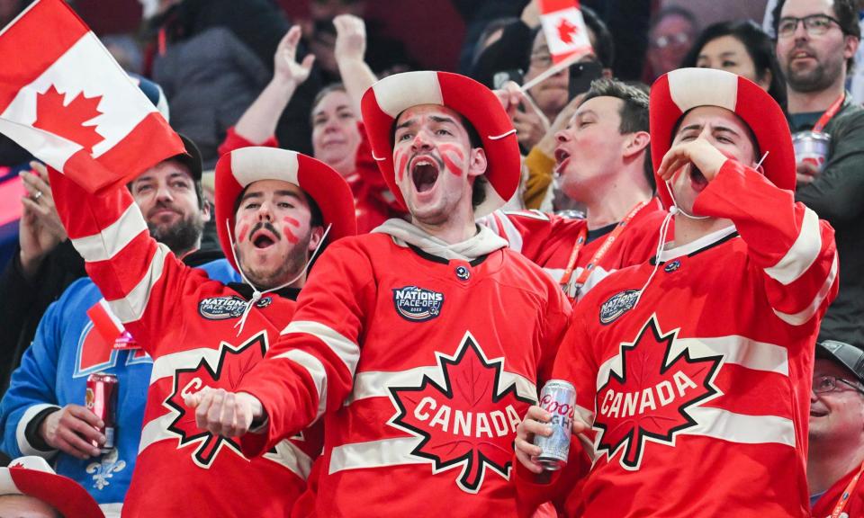 <span>Canada fans cheer their team as they take to the ice ahead of their 4 Nations Face-Off hockey game against the United States in Montreal on Saturday night.</span><span>Photograph: Graham Hughes/AP</span>