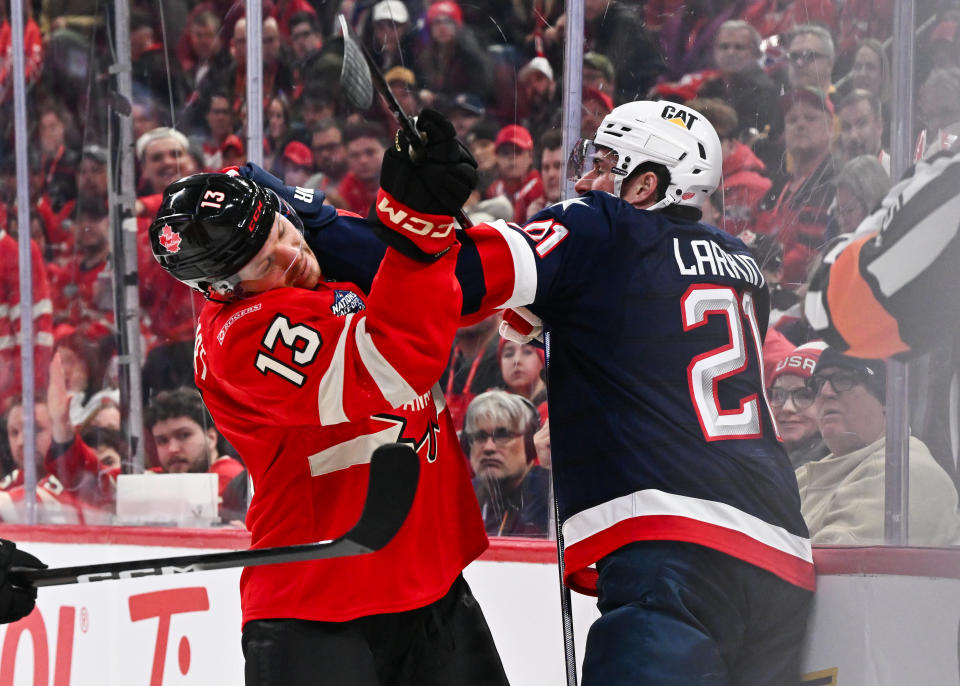 Sam Reinhart of Team Canada and Dylan Larkin of Team USA battle it out during the third period in the 2025 NHL 4 Nations Face-Off. (Photo by Minas Panagiotakis/Getty Images)