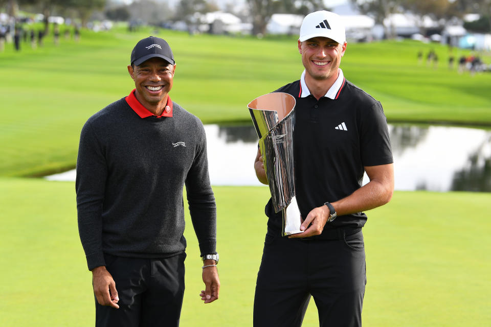 Ludvig Åberg and friend pose with the Genesis Invitational trophy. (Brian Rothmuller/Icon Sportswire via Getty Images)