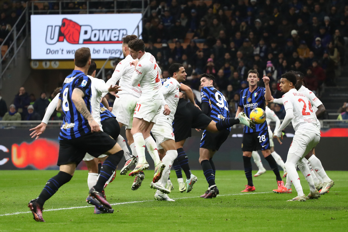 Marin Pongracic of Fiorentina (midair, red stripes on boots) scores an own go during the Serie A match between FC Internazionale and Fiorentina at Stadio Giuseppe Meazza on February 10, 2025 in Milan, Italy. (Photo by Marco Luzzani/Getty Images)