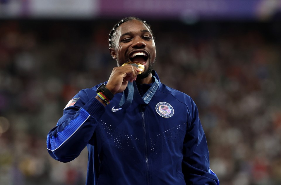 Noah Lyles, a member of the U.S. Olympic team, celebrates his gold medal win.