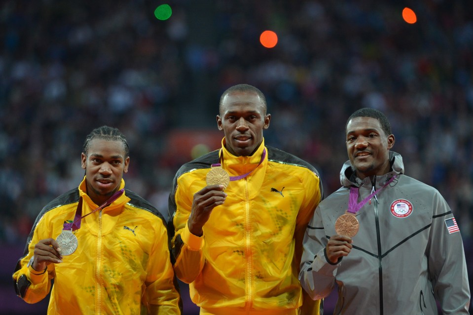 Usain Bolt, Yohan Blake, and Justin Gatlin on the winners' podium at the 2012 Olympics 100m men's race.