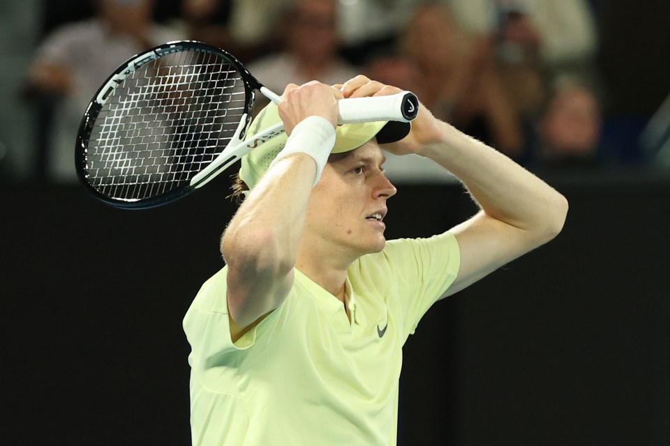 Jannik Sinner of Italy celebrating a tennis match victory.