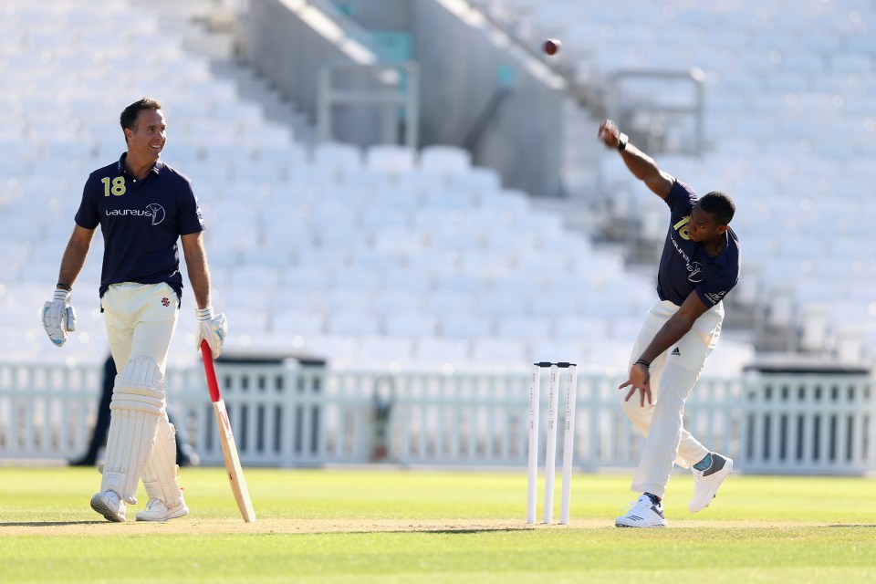 Yohan Blake bowling to Michael Vaughan during a cricket match.