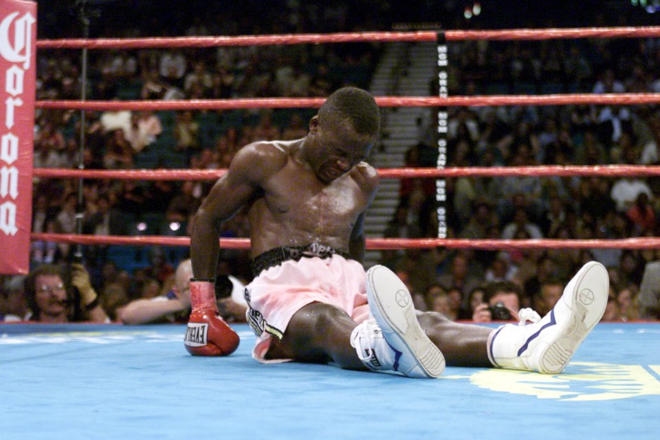 23 Jun 2001: Lehlohonolo Ledwaba attempts to get himself up after being knocked down by Manny Pacquiao during IBF Super Bantamweight Championship bout at the MGM Grand Hotel & Casino in Las Vegas, Nevada.  Pacquiao won the bout by way of knockout after 6 rounds. DIGITAL IMAGE. Mandatory Credit: Jed Jacobsohn/Allsport