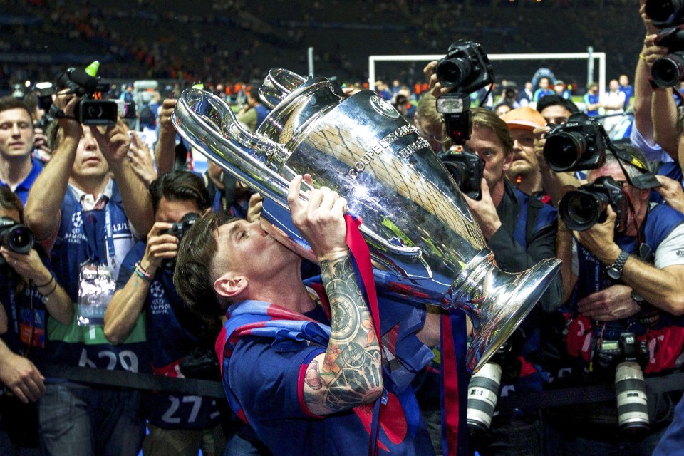 Lionel Messi kissing the Champions League trophy.