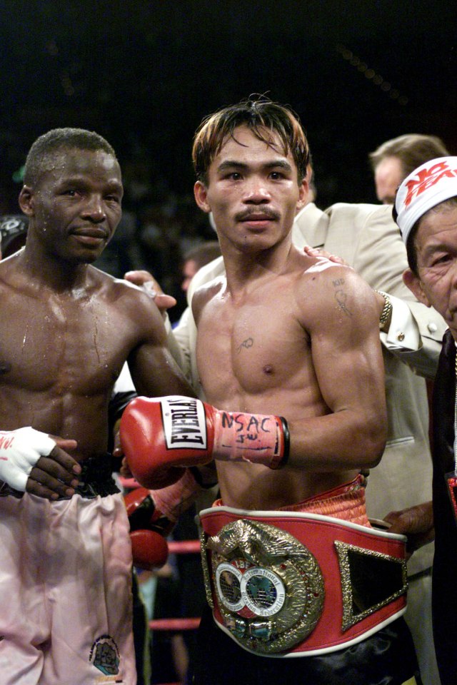 23 Jun 2001:  Manny Paquiao shows off his belt after his victory over Lehlohonolo Ledwaba during IBF Super Bantamweight Championship bout at the MGM Grand Hotel & Casino in Las Vegas, Nevada.  Pacquiao won the bout by way of knockout after 6 rounds. DIGITAL IMAGE. Mandatory Credit: Jed Jacobsohn/Allsport