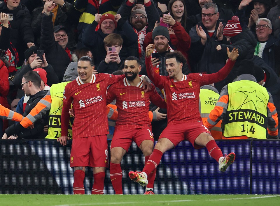 Liverpool players celebrating a goal.