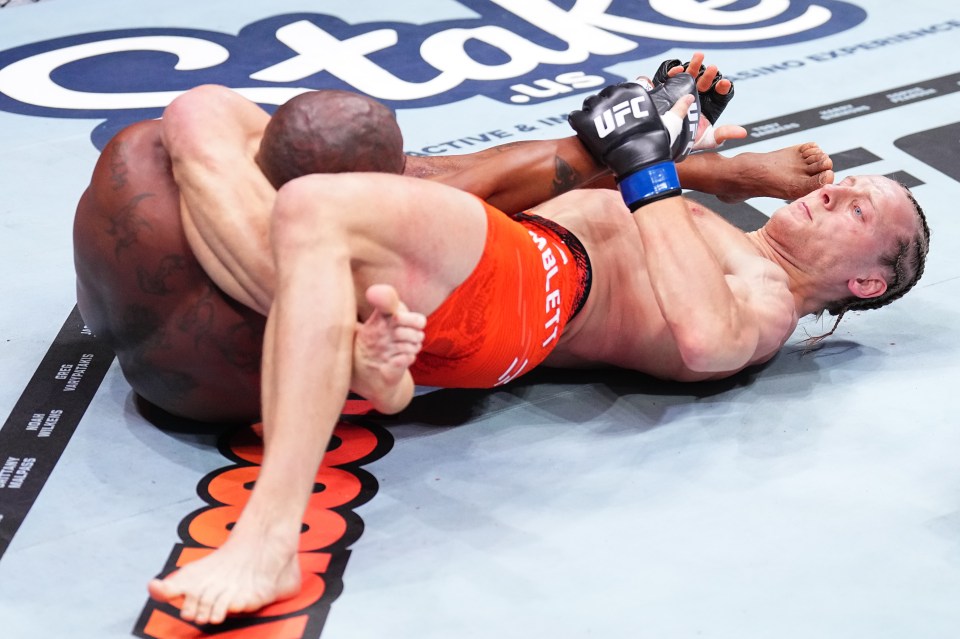 Paddy Pimblett securing a submission in a UFC match.