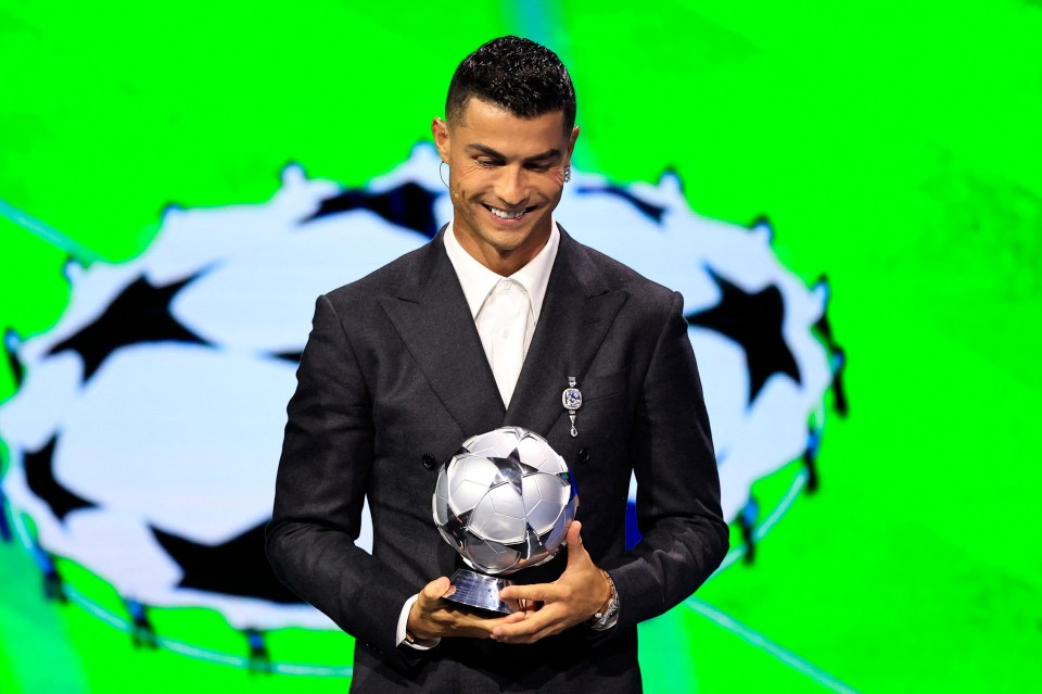 Cristiano Ronaldo holding his All-Time Goalscorer Award.