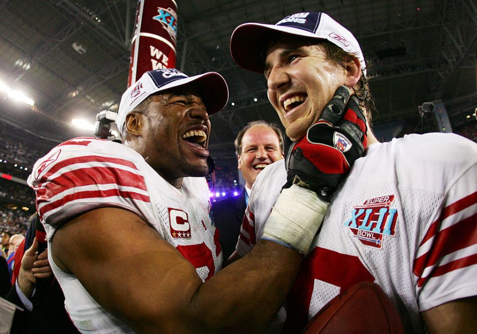 Eli Manning was a Patriots stopper and so successful that Michael Strahan couldn't stop smiling