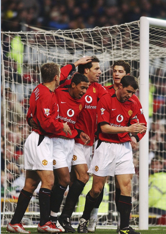 Manchester United players celebrating a goal.