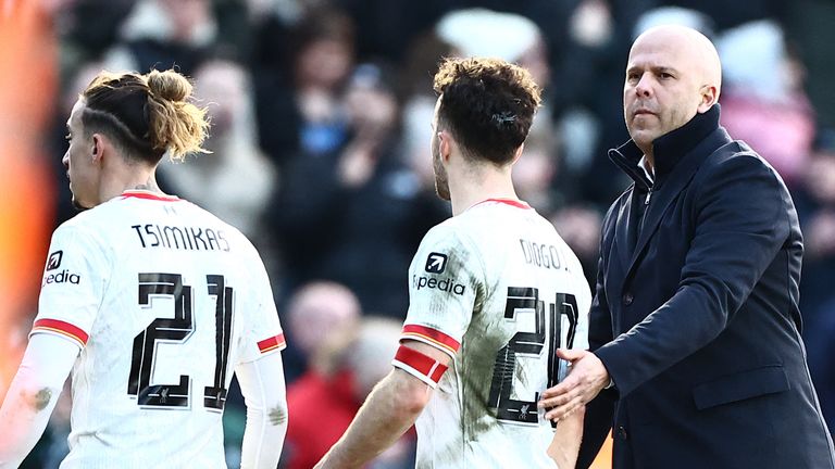 Liverpool's Arne Slot commiserates Diogo Jota after defeat to Plymouth