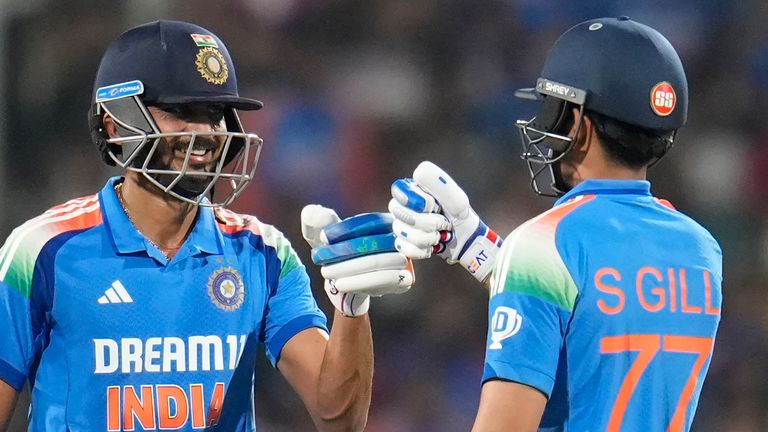 India's Shubman Gill, right, and Axar Patel celebrate scoring runs during the first one day international cricket match between India and England at Vidarbha Stadium in Nagpur, India, Thursday, Feb. 6, 2025. (AP Photo/Aijaz Rahi)