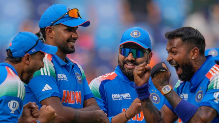 India's Hardik Pandya, right, celebrates with teammate the wicket of Pakistan's Saud Shakeel during the ICC Champions Trophy cricket match between India and Pakistan at Dubai International Cricket Stadium, United Arab Emirates, Sunday, Feb. 23, 2025. (AP Photo/Altaf Qadri)