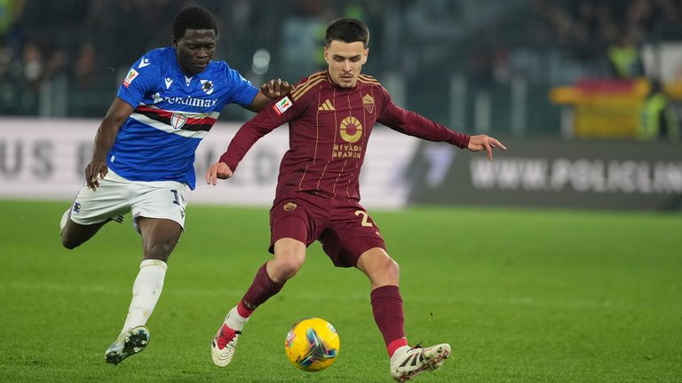 Roma's Enzo Le Fee, right, and Sampdoria's Ebenezer Akinsanmiro challenge for the ball during the Italian Cup soccer match between Roma and Sampdoria, at Rome's Olympic Stadium, Wednesday, Dec. 18, 2024. (AP Photo/Andrew Medichini)