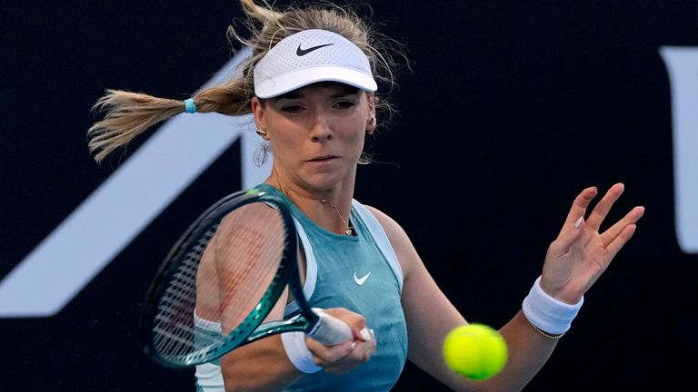 Katie Boulter of Britain plays a forehand return to Veronika Kudermetova of Russia during their second round match at the Australian Open tennis championship in Melbourne, Australia, Thursday, Jan. 16, 2025. (AP Photo/Manish Swarup)