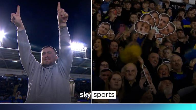 Luke Littler receives a huge welcome as he walks out in front of the fans at Warrington