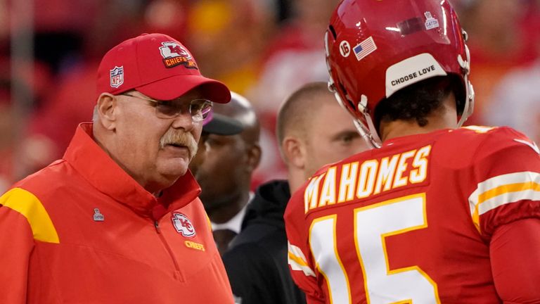 Kansas City Chiefs quarterback Patrick Mahomes (15) talks with Kansas City Chiefs head coach Andy Reid while warming up before the start of an NFL football game against the Las Vegas Raiders Monday, Oct. 10, 2022, in Kansas City, Mo. (AP Photo/Ed Zurga)