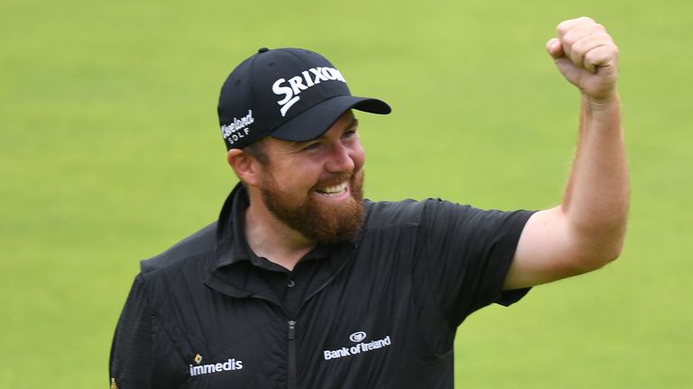 Ireland's Shane Lowry celebrates as he walks up the 18th fairway during the final round of the British Open golf Championships at Royal Portrush golf club in Northern Ireland on July 21, 2019.