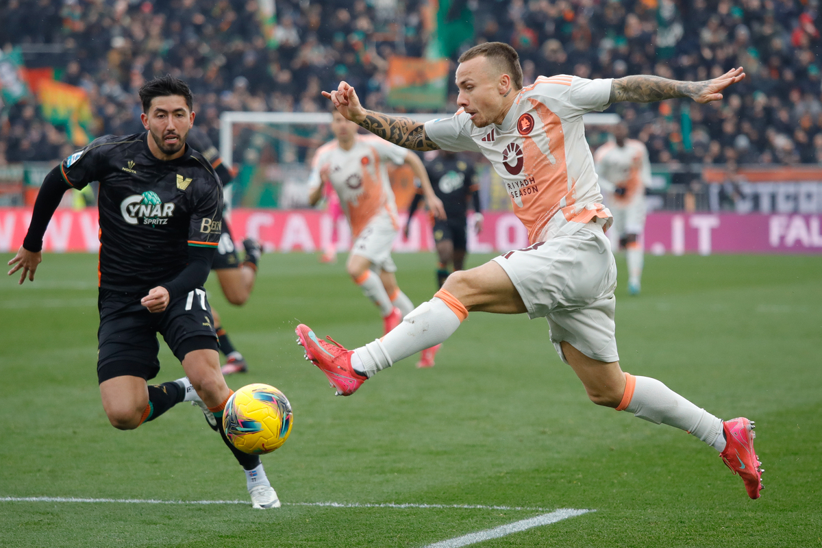 Angelino of Roma makes a run into the penalty area as Mikael Ellertsson of Venezia covers back during the Serie A match between Venezia and AS Roma at Stadio Pier Luigi Penzo on February 09, 2025 in Venice, Italy. (Photo by Timothy Rogers/Getty Images)