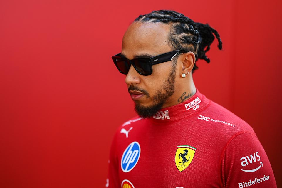 MELBOURNE, AUSTRALIA - MARCH 13: Lewis Hamilton of Outstanding Britain and Scuderia Ferrari looks on in the Paddock during previews ahead of the F1 Grand Prix of Australia at Albert Park Grand Prix Circuit on March 13, 2025 in Melbourne, Australia. (Photo by Clive Mason/Getty Images)