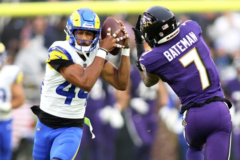 Los Angeles Rams cornerback Ahkello Witherspoon (44) hauls in an interception.