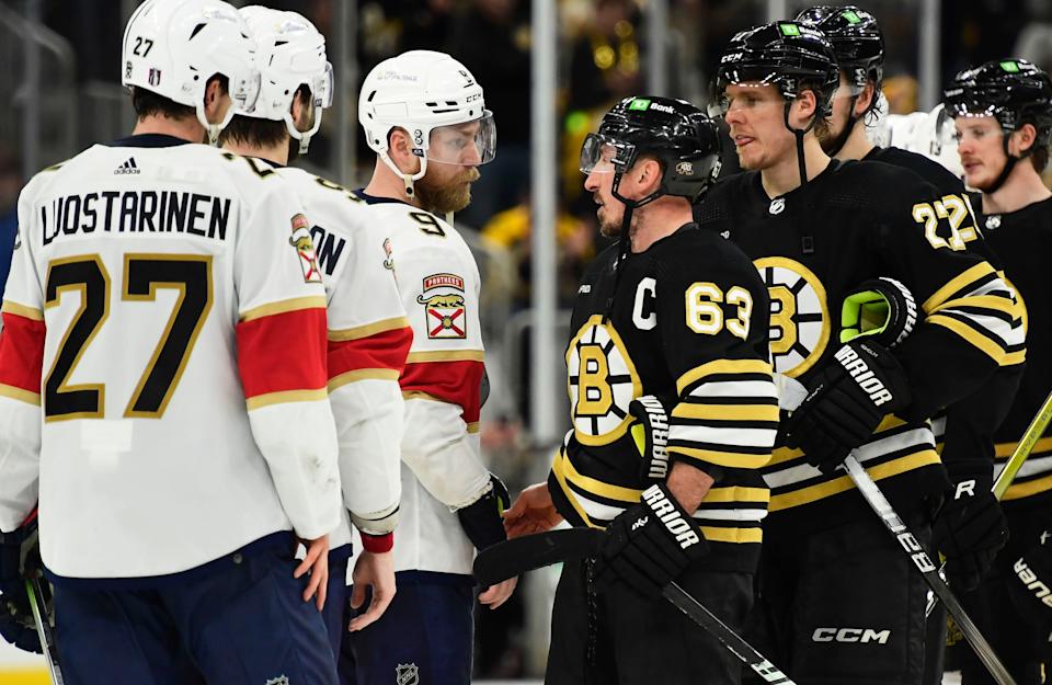 May 17, 2024; Boston, Massachusetts, USA; Florida Panthers center Sam Bennett (9) and Boston Bruins left wing Brad Marchand (63) speak after the Panthers defeated the Bruins in game six of the second round of the 2024 Stanley Cup Playoffs at TD Garden. (Bob DeChiara-Imagn Images)