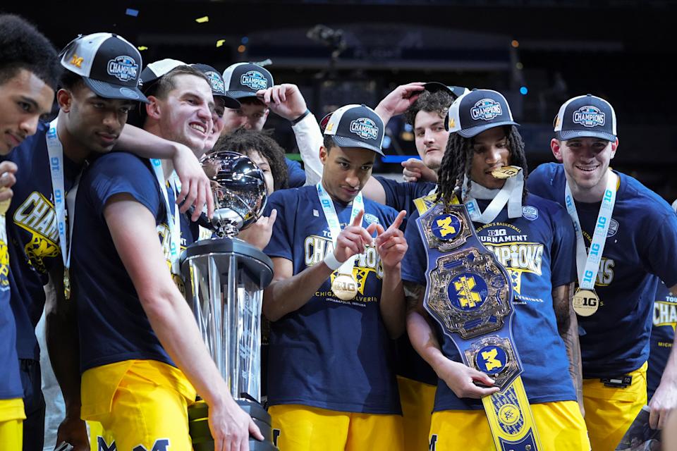 Michigan players celebrate after an NCAA college basketball game against Wisconsin in the Bracket of the Big Ten Conference Bracket in Indianapolis, Sunday, March 16, 2025. (AP Photo/Michael Conroy)