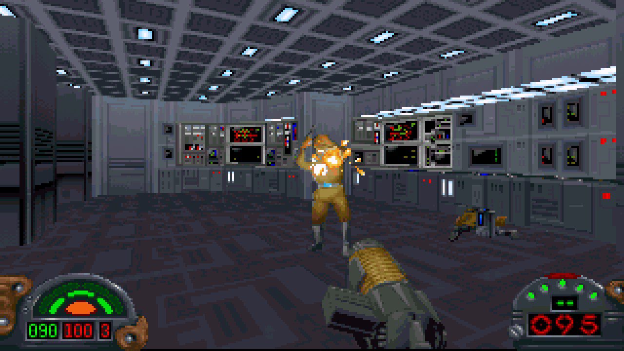 Still from the video game Star Wars: Dark Forces. The room is a futuristic computer room designed in a 2.5D pixel art style. You are holding a gun and shooting an enemy in front of you.