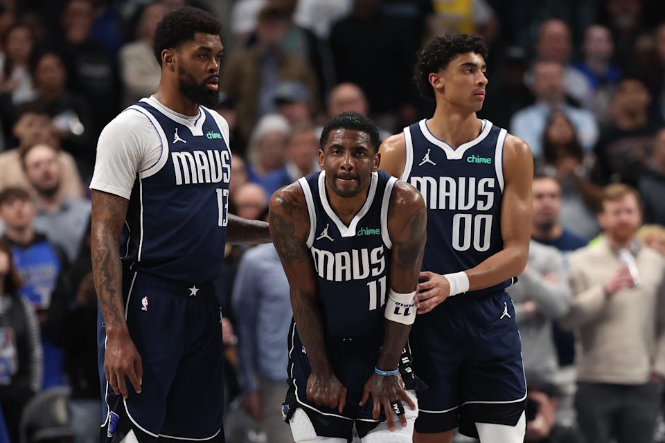 DALLAS, TEXAS - MARCH 03: (L-R) Naji Marshall #13, Kyrie Irving #11 and Max Christie #00 of the Dallas Mavericks pause during the first half against the Sacramento Kings at American Airlines Center on March 03, 2025 in Dallas, Texas. NOTE TO USER: User expressly acknowledges and agrees that, by downloading and/or using this photograph, user is consenting to the terms and conditions of the Getty Images License Agreement. (Photo by Sam Hodde/Getty Images)