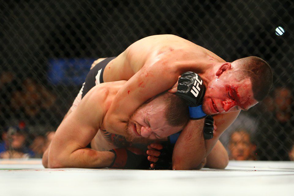 Nate Diaz submits Conor McGregor in a bloody UFC fight.