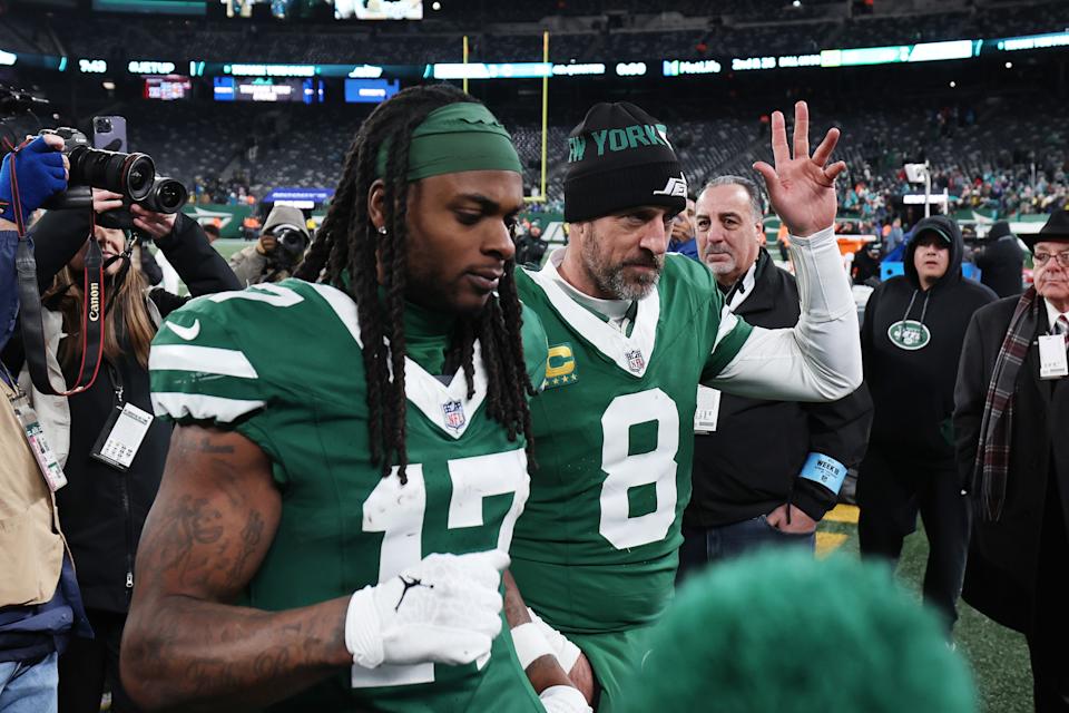 EAST RUTHERFORD, NEW JERSEY - JANUARY 05: Aaron Rodgers #8 and Davante Adams #17 of the New York Jets leave the Ground after beating the Miami Dolphins 32-20 at MetLife Stadium on January 05, 2025 in East Rutherford, New Jersey. (Photo by Luke Hales/Getty Images)