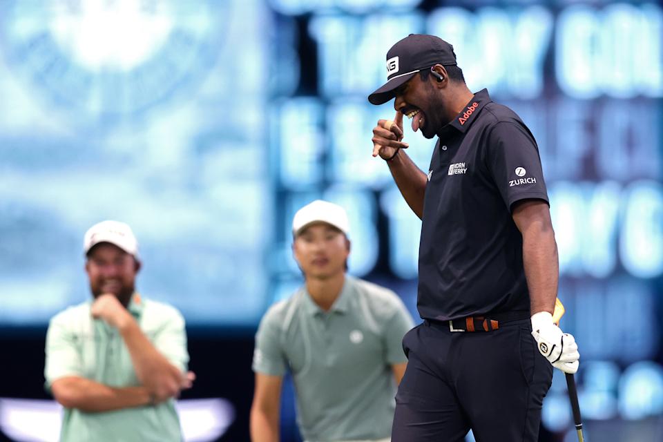 Sahith Theegala gloats as Shane Lowry and Min Woo Lee look on. (Megan Briggs/TGL/TGL via Getty Images)